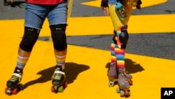 FILE - Protesters on roller skates attend the All Black Lives Matter march, organized by black LGBTQ+ leaders in Los Angeles on June 14, 2020. Roller skating has been enjoying a 2020s revival. (AP Photo/Paula Munoz, File)