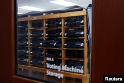 Voting ballot scanners are stored in a secure room amid heightened security measures ahead of the midterm elections at the Leon County Supervisor of Elections office in Tallahassee, Florida, Oct. 5, 2022.