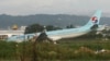 A damaged Korean Air plane lies after it overshot the runway at the Mactan-Cebu International Airport in Cebu, central Philippines early Oct. 24, 2022. The Korean Air plane overshot the runway while landing in bad weather in the central Philippines