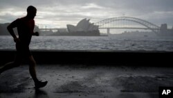 A man runs along the waterfront in Sydney, Australia, Oct. 6, 2022. 