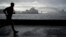 A man runs along the waterfront in Sydney, Australia, Oct. 6, 2022. 