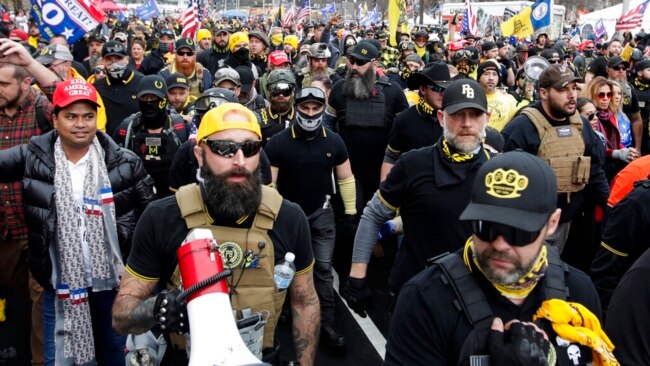 FILE - Jeremy Joseph Bertino, second from left, is pictured at a rally at Freedom Plaza, Dec. 12, 2020, in Washington. Bertino pleaded guilty Oct. 6, 2022, of plotting with other Proud Boys to violently stop the transfer of presidential power after the 2020 election.