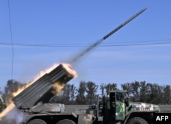 Ukrainian BM-21 'Grad' multiple rocket launcher fires a rocket towards Russian positions in an undisclosed location in the South of Ukraine on Oct. 3, 202