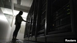 FILE - An employee works inside a server room at a company in Bangkok, Thailand, November 22, 2016. (REUTERS/Athit Perawongmetha)