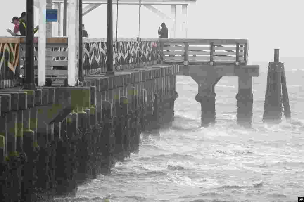 Waves crash along the Ballast Point Pier ahead of Hurricane Ian, Sept. 28, 2022, in Tampa, Florida.