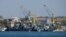 FILE - Russian Black Sea fleet ships are seen in one of the bays of Sevastopol, in Russia-annexed Crimea, March 31, 2014. On Oct. 29, 2022, at two Russian ships in Sevastopol's port suffered damage in an attack Russia is using to justify its suspension of the grain export deal.