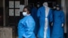 Health experts at the Ebola Treatment Unit working inside a ward at Mubende Regional Referral Hospital, September 24, 2022.
