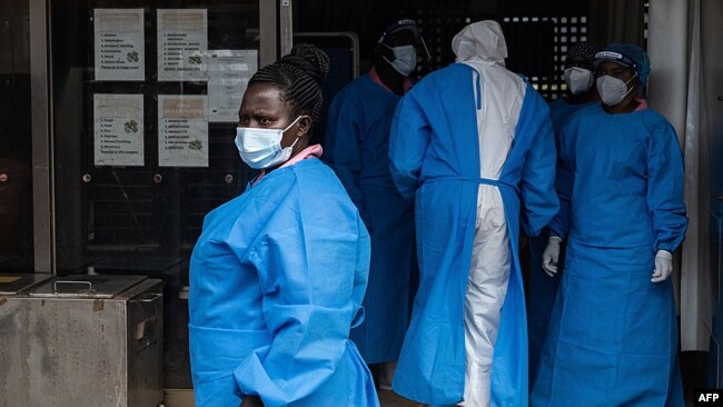 Medical staff members in protective gear are seen at Mubende Regional Referral Hospital, in Mubende, Uganda, Sept. 24, 2022.