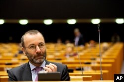 FILE - German MEP Manfred Weber attends a session in the Plenary chamber of the European Parliament in Brussels, March 10, 2020.
