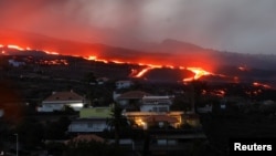 Lava from the Cumbre Vieja volcano flows as seen from Tajuya on the Canary Island of La Palma, Spain, October 19, 2021. (REUTERS/Susana Vera)