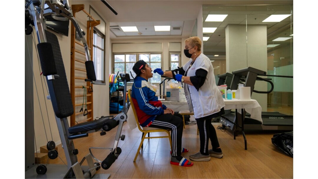 FILE - A man gets a PCR coronavirus test at a private nursing home in Netanya, Israel, Jan. 5, 2022.