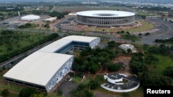 An aerial view of the Mane Garrincha National Stadium (R) and the Convention Center Ulysses Guimaraes in Brasilia, Brazil, Jan. 20, 2014.