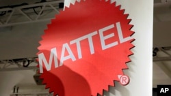 FILE - The Mattel logo at the TTPM 2018 Spring Showcase in New York, April 26, 2018. Mattel says it will cut 2,200 jobs as the maker of Barbie dolls and Hot Wheels cars tries to save money.