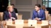 Le premier ministre du Canada, Justin Trudeau (R) et le président des États-Unis, Donald Trump, participent à la séance de travail du sommet du G7 dans la ville de Charlevoix, à La Malbaie, au Québec, le 8 juin 2018.