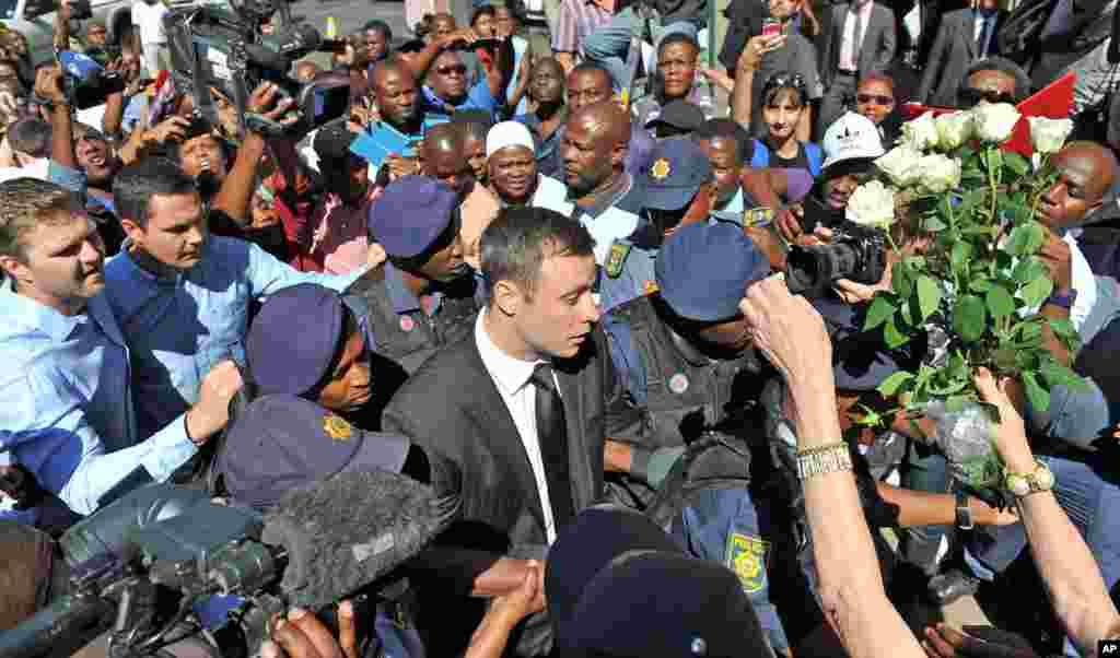 Oscar Pistorius arrives outside the court in Pretoria, South Africa, Oct. 21, 2014.