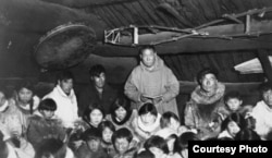 Gathering inside a qasdiq, southwest Alaska, ca. 1925. Courtesy of the Anchorage Museum, Martin Collection, B07.5.1.A23.