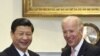 U.S. Vice President Joseph Biden (R) and China's Vice President Xi Jinping stand together before an expanded bilateral meeting in the Roosevelt Room at the White House in Washington, February 14, 2012.