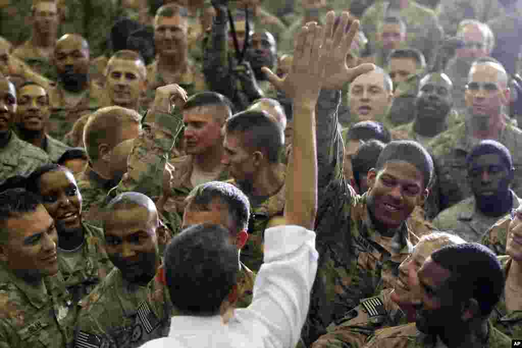 President Barack Obama gets a high five as he greets troops at Bagram Air Field, Afghanistan, early Wednesday, May 2, 2012. (AP)