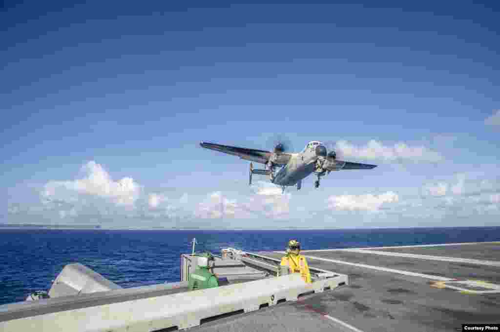 A C-2A Greyhound carrying relief supplies for Operation Damayan prepares to land on the flight deck of the U.S. Navy's forward-deployed aircraft carrier USS George Washington, Nov. 15, 2013. (U.S. Navy)