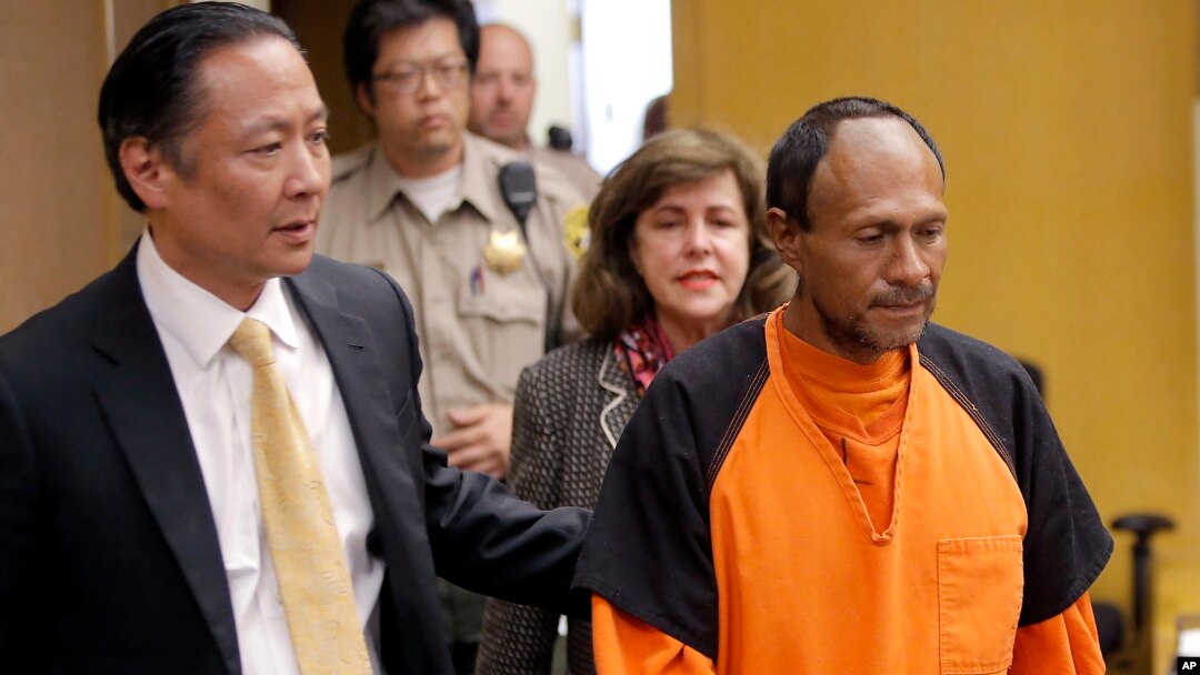 FILE - Juan Francisco Lopez-Sanchez (R), charged with the murder of 32-year-old Kate Steinle, is seen being escorted into a courtroom at the Hall of Justice in San Francisco, California, July 7, 2015.