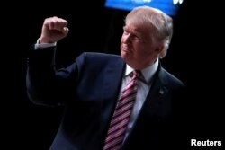 FILE - Republican U.S. presidential nominee Donald Trump reacts at a campaign rally in Panama City, Florida, U.S., Oct. 11, 2016.