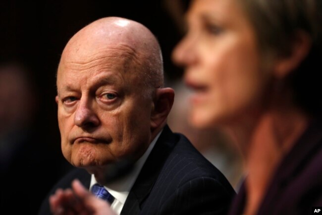 Former National Intelligence Director James Clapper listens as former acting Attorney General Sally Yates testifies on Capitol Hill in Washington, May 8, 2017