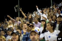 While most South Americans prefer soccer, Venezuela is crazy about baseball — even with games becoming more expensive to attend. These fans watch a game between the Leones de Caracas and the Navegantes del Magallanes in Caracas, Oct. 27, 2015.