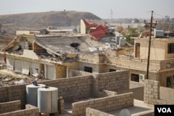 Not one house or store in Bashiqa, Iraq, has escaped some damage, and hundreds are now just rubble, Nov. 8, 2016. (J. Dettmer/VOA)
