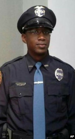 This undated photo released by the Hattiesburg Police Department, shows Officer Liquori Tate in Hattiesburg, Miss.