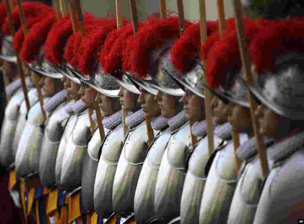 Swiss Guard recruits stands at attention during the swearing-in ceremony at the Vatican.