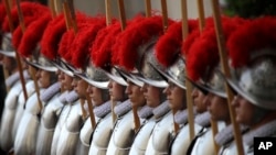 Swiss Guard recruits stands at attention during the swearing-in ceremony at the Vatican, Sunday, May 6, 2018.