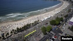 Demonstrators attend a protest against Brazil's President Dilma Rousseff, part of nationwide protests calling for her impeachment, in Copacabana in Rio de Janeiro, Brazil, Aug. 16, 2015. 