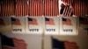 Jim Smith steps out of a voting booth after marking his ballot at a polling site for the New Hampshire primary, Feb. 9, 2016, in Nashua, N.H. 