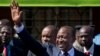 Kenya's President-Elect Uhuru Kenyatta gestures to supporters as he leaves the National Election Center where final election results were announced declaring he would be the country's next president, in Nairobi, Kenya Saturday, March 9, 2013. Uhuru Kenyat