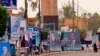 Campaign posters for Iraqi Sunni political blocks line a street in the predominately Sunni neighborhood of Azamiya, in north Baghdad, Iraq, May 8, 2018.