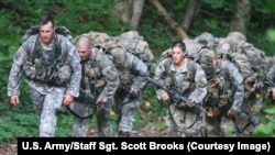 FILE - U.S. Army Ranger candidate soldiers, burdened with heavy packs and weapons, conduct Mountaineering training during the Ranger Course on Mount Yonah in Cleveland, Georgia, July 14, 2015.