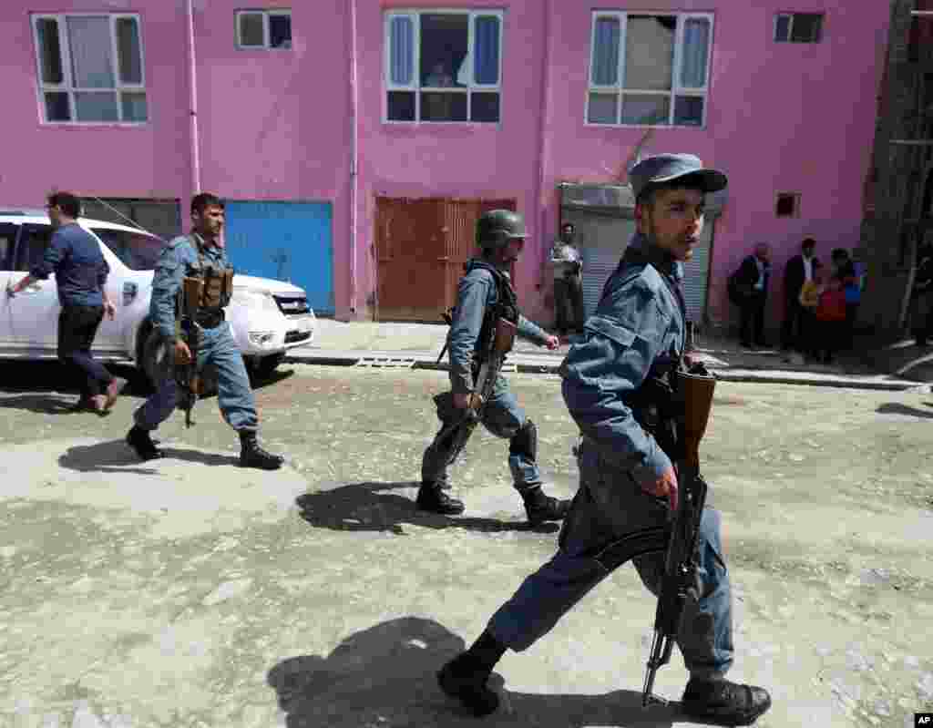 Afghan security forces on patrol near the site of a suicide attack in Kabul, Afghanistan, May 4, 2015.