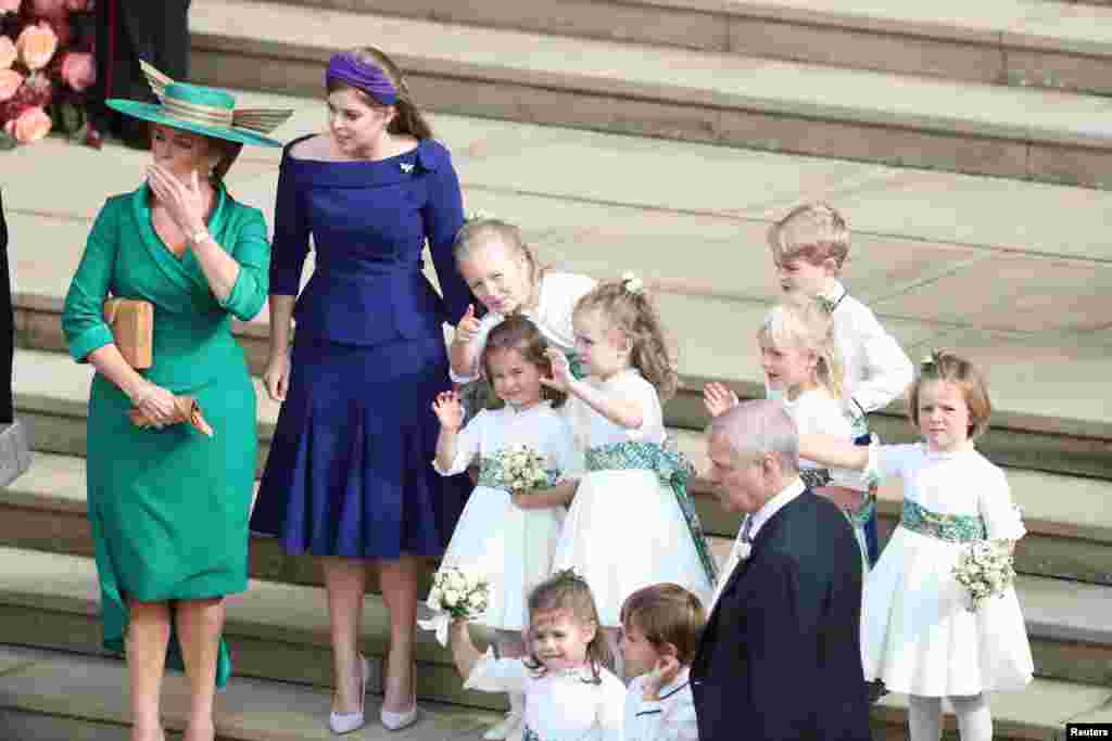 Sarah Ferguson, Princess Beatrice and the bridesmaids and page boys, including Princess Charlotte and Prince George wave off Princess Eugenie and her new husband Jack Brooksbank as they leave St George's Chapel in Windsor Castle following their wedding, i