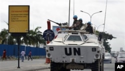Jordanian UN soldiers drive in a armored personnel carrier, in Abidjan, Ivory Coast, March 1, 2011