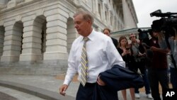 Sen. Lindsey Graham, R-S.C., departs Capitol Hill, Oct. 6, 2018, in Washington.