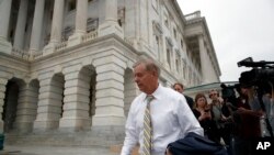 Sen. Lindsey Graham, R-S.C., departs Capitol Hill, Oct. 6, 2018, in Washington.