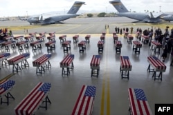 Flag draped transfer cases with the remains of American soldiers repatriated from North Korea are seen during a repatriation ceremony after arriving to Joint Base Pearl Harbor-Hickam, Honolulu, Hawaii, Aug. 1, 2018.