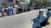 Afghans line up outside a bank to take out their money after Taliban takeover in Kabul, Afghanistan September 1, 2021. REUTERS/Stringer