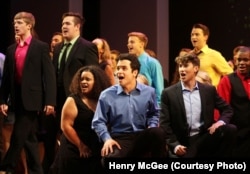 The young performers take to the stage before an audience on Broadway.