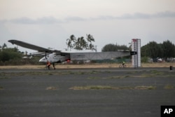 The Solar Impulse 2, a solar-powered airplane, lands at the Kalaeloa Airport, July 3, 2015 in Kapolei, HI.
