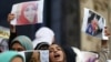FILE - Female relatives of women prisoners shout slogans against the military and the interior ministry at an event called "Release Our Girls" during International Women's Day in front of the Press Syndicate in Cairo, Egypt.