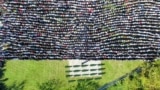 Mourners gather as they attend the collective funeral for 19 victims of a landslide caused by recent floods in Jablanica, Bosnia.