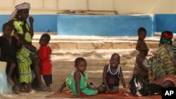 Children suffering from lead poisoning wait to see medical workers, in Gusau, Nigeria, June 9, 2010.