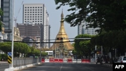 MYANMAR-MILITARY-POLITICS-COUP-RELIGION-THINGYAN Barricades are seen along a road leading to Sule Pagoda during the Thingyan water festival, marking the Buddhist new year, in Yangon on April 13, 2022. (Photo by AFP)