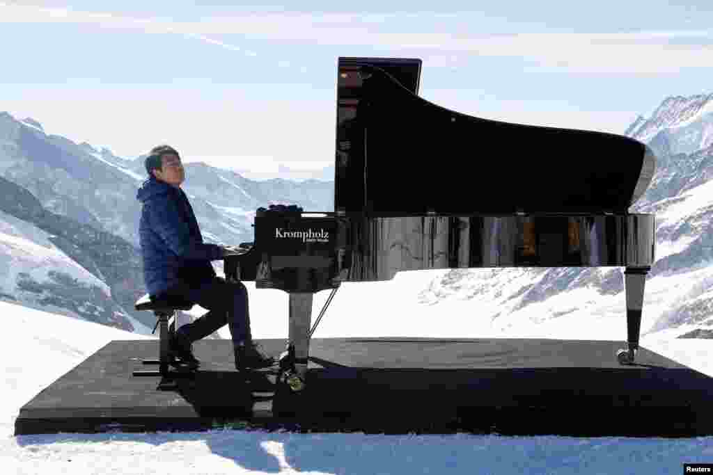 Pianist Lang Lang performs at the Jungfraujoch, Switzerland.